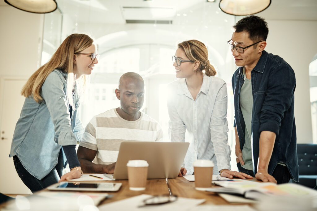 A direct marketing team collaborating with each other.